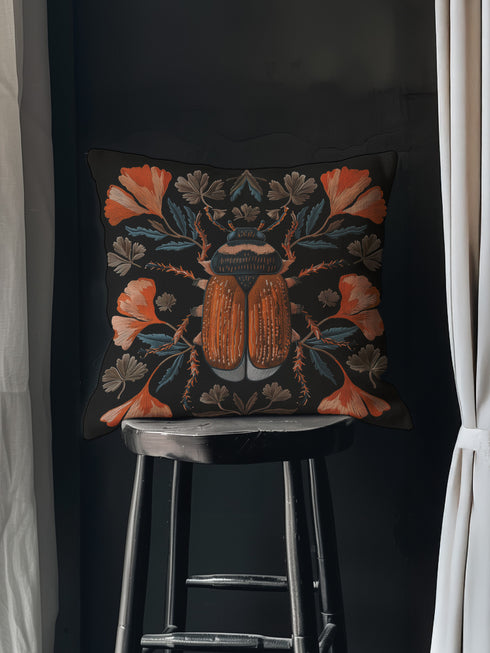 Luxury black pillowcase featuring a detailed scarab beetle with vibrant coral-orange wings and navy thorax, surrounded by symmetrical coral flowers and teal leaves. The intricate entomology illustration shows fine linework with scientific precision against a deep black background.
